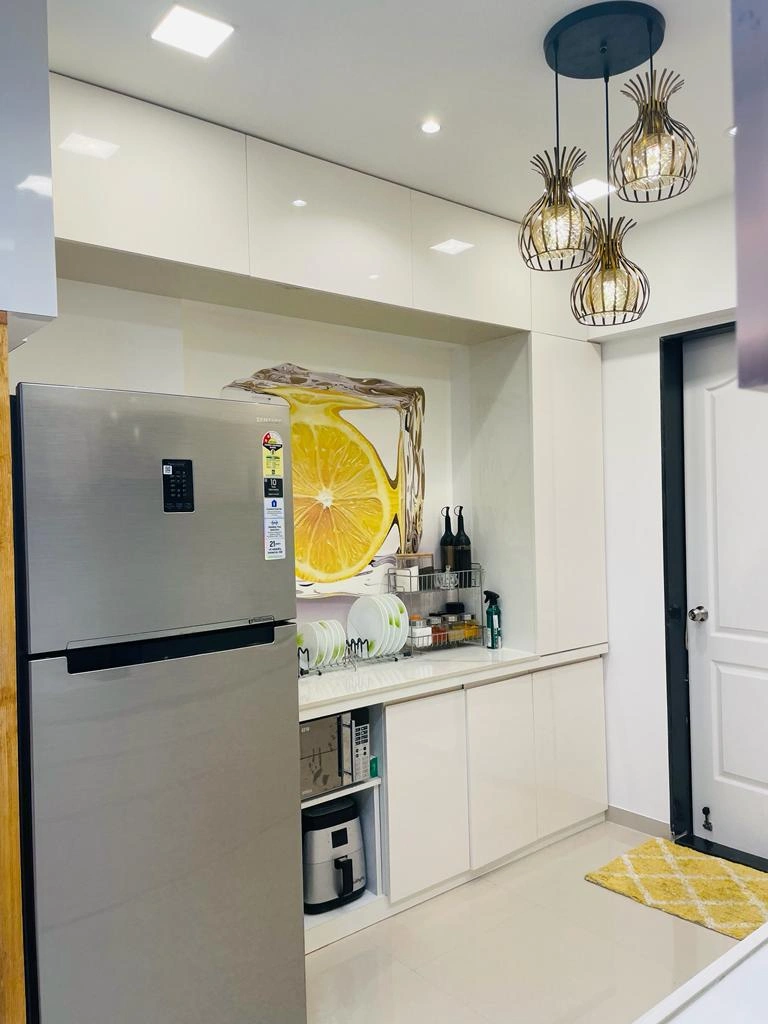 White modular kitchen with pendant lights